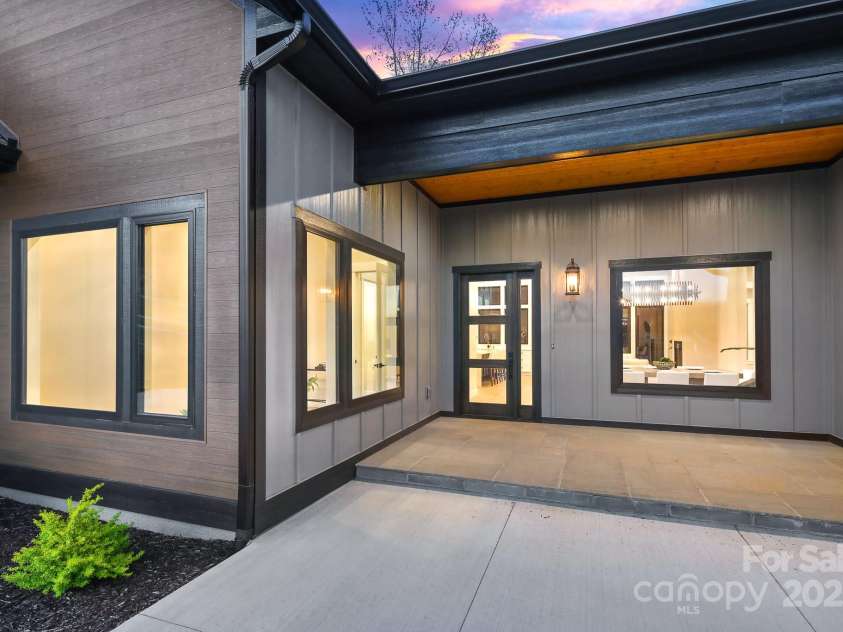 24 Slate Drive, Candler, NC 28715.  MLS# CAR4244090, YatesRealty ID 20953. Twilight front view