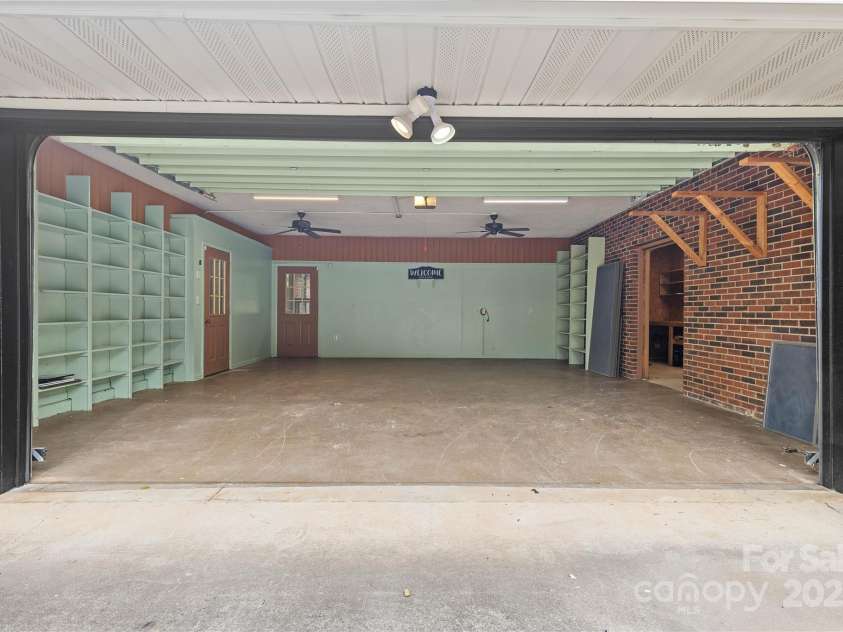5916 Cashion Road, Huntersville, NC 28078.  MLS# CAR4266998, YatesRealty ID 20960. 2 Car Garage with Ceiling Fans, Built-in Shelving and LED Lighting