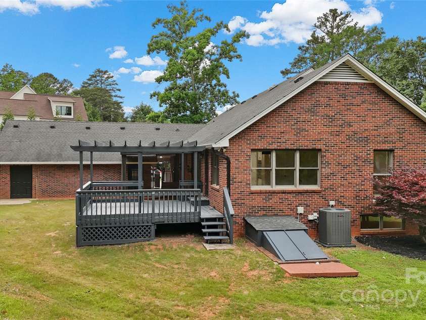 5916 Cashion Road, Huntersville, NC 28078.  MLS# CAR4266998, YatesRealty ID 20960. Side Elevation with Basement Level Entry Doors