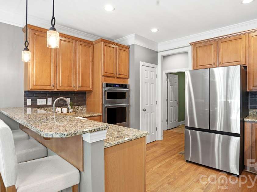 4089 Harmattan Drive, Denver, NC 28037.  MLS# CAR4377560, YatesRealty ID 20961. Granite Counters, Bar Seating, Refrigerator Included!