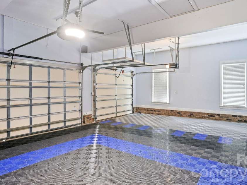 4089 Harmattan Drive, Denver, NC 28037.  MLS# CAR4377560, YatesRealty ID 20961. Mini Split, Race Deck Flooring, and Custom Shelving in Garag