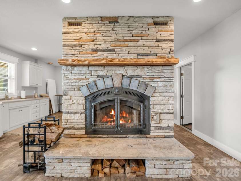 24 Chapel Hill Lane, Leicester, NC 28748.  MLS# CAR4354075, YatesRealty ID 20967. Stone Wood Burning Fireplace