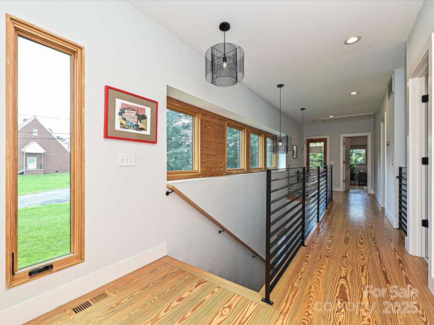 2553 Elkwood Circle, Charlotte, NC 28205.  MLS# CAR4272669, YatesRealty ID 20971. Heart Pine hallway w/ custom railing