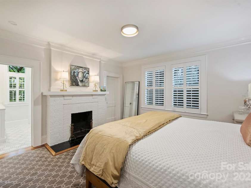 726 Kingston Avenue, Charlotte, NC 28203.  MLS# CAR4272217, YatesRealty ID 20972. Primary bedroom with walk-in closet and fireplace