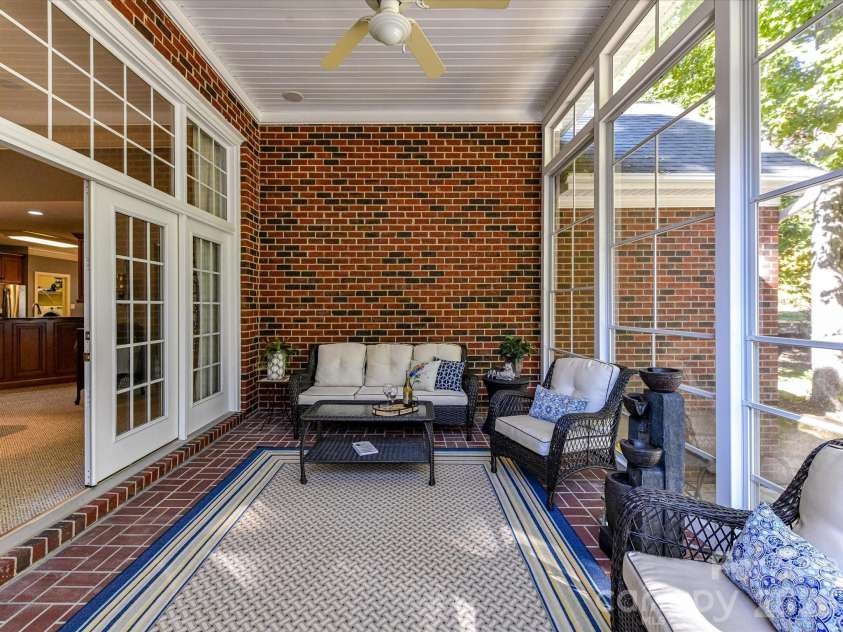 3515 Savannah Way, Monroe, NC 28110.  MLS# CAR4313596, YatesRealty ID 20977. Easy Breezy Screened Porch w/Brick Flooring