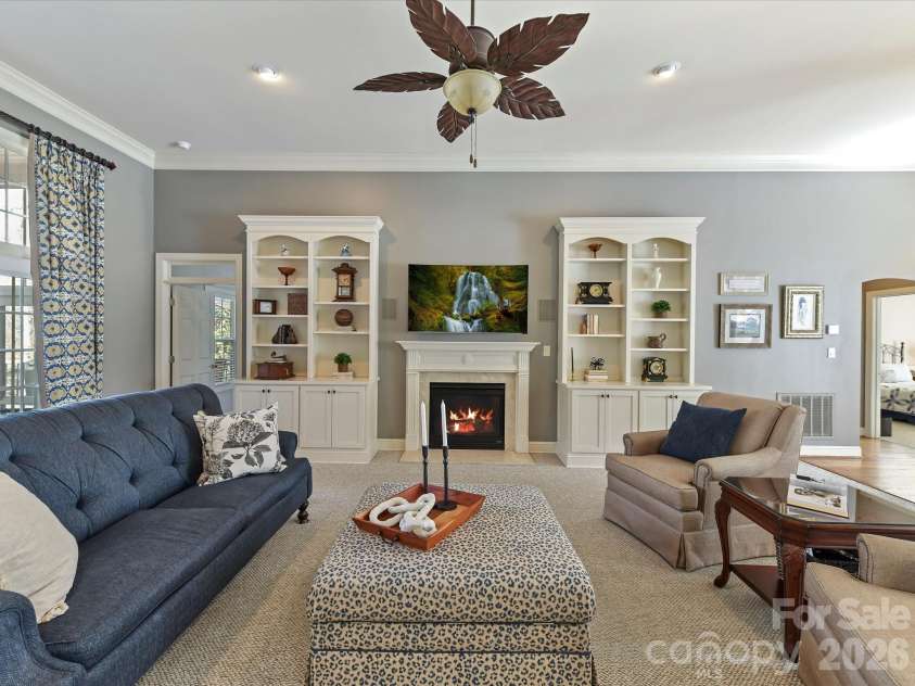 3515 Savannah Way, Monroe, NC 28110.  MLS# CAR4313596, YatesRealty ID 20977. Open Great Room w/Dual Custom Bookcases.