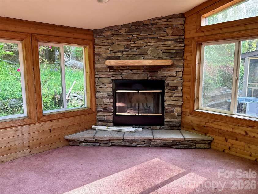 44 Sagebrush Circle, Etowah, NC 28729.  MLS# CAR4370177, YatesRealty ID 20979. Fireplace in Sunroom