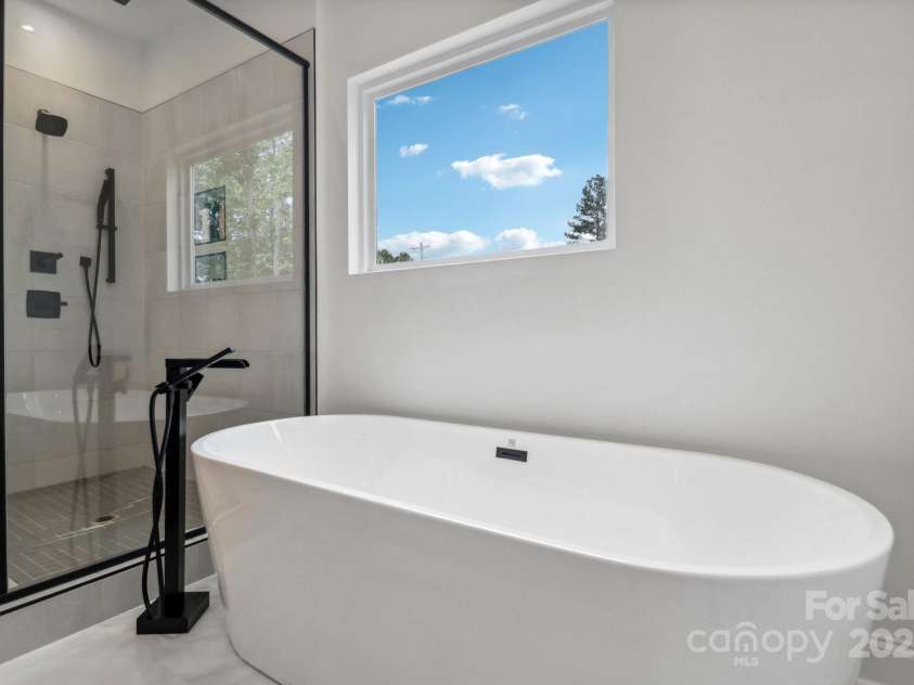 545 Morrison Farm Road, Troutman, NC 28166.  MLS# CAR4314529, YatesRealty ID 20985. Soaking tub and extra large shower