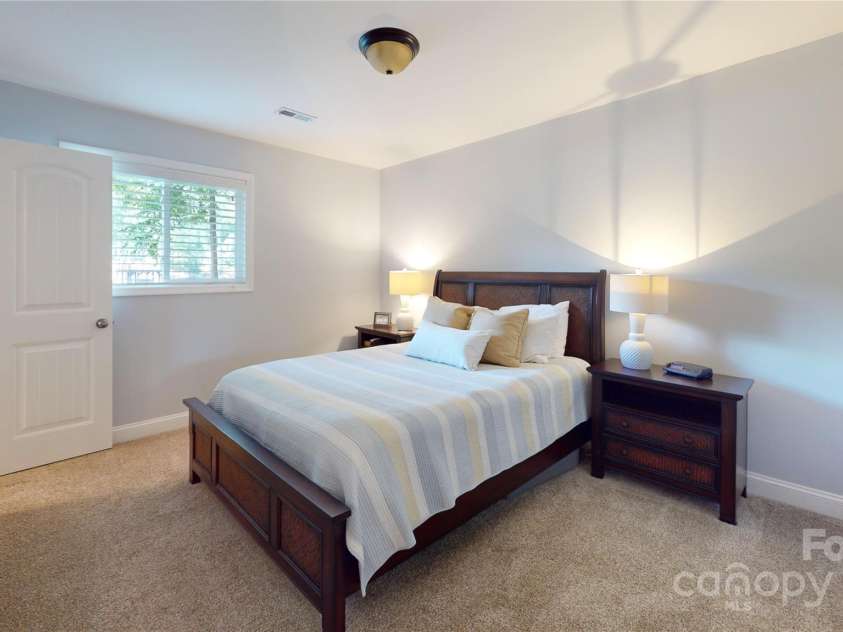 114 Caraway Lane, Mooresville, NC 28117.  MLS# CAR4268740, YatesRealty ID 20994. Bedroom 2 with ensuite bath and water views.