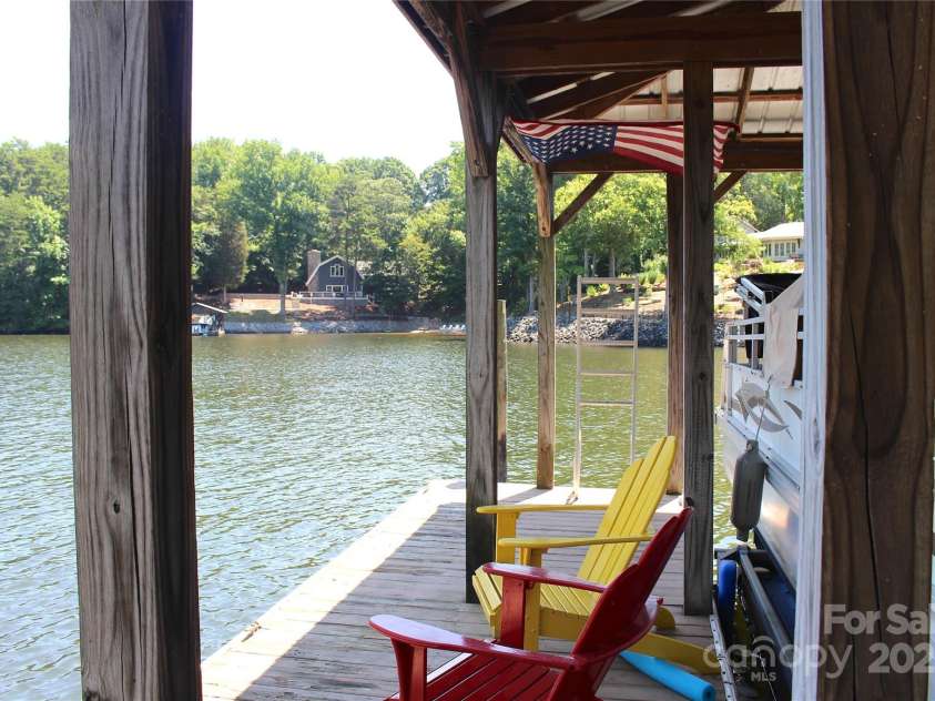 114 Caraway Lane, Mooresville, NC 28117.  MLS# CAR4268740, YatesRealty ID 20994. Room to relax on dock, stairs at end for water access.