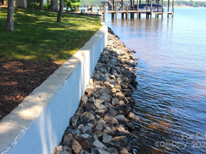 114 Caraway Lane, Mooresville, NC 28117.  MLS# CAR4268740, YatesRealty ID 20994. Shoreline retaining wall.