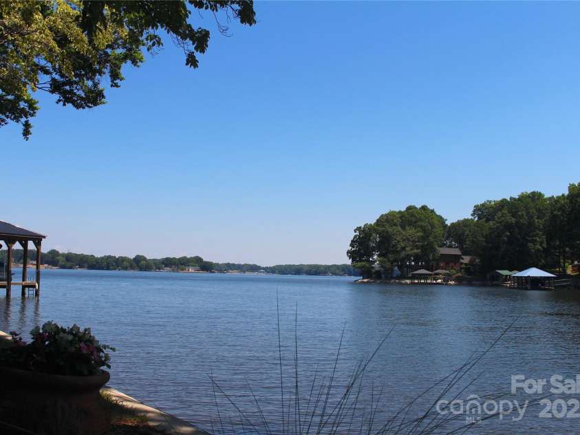 114 Caraway Lane, Mooresville, NC 28117.  MLS# CAR4268740, YatesRealty ID 20994. Wide, deep water cove with big water views.