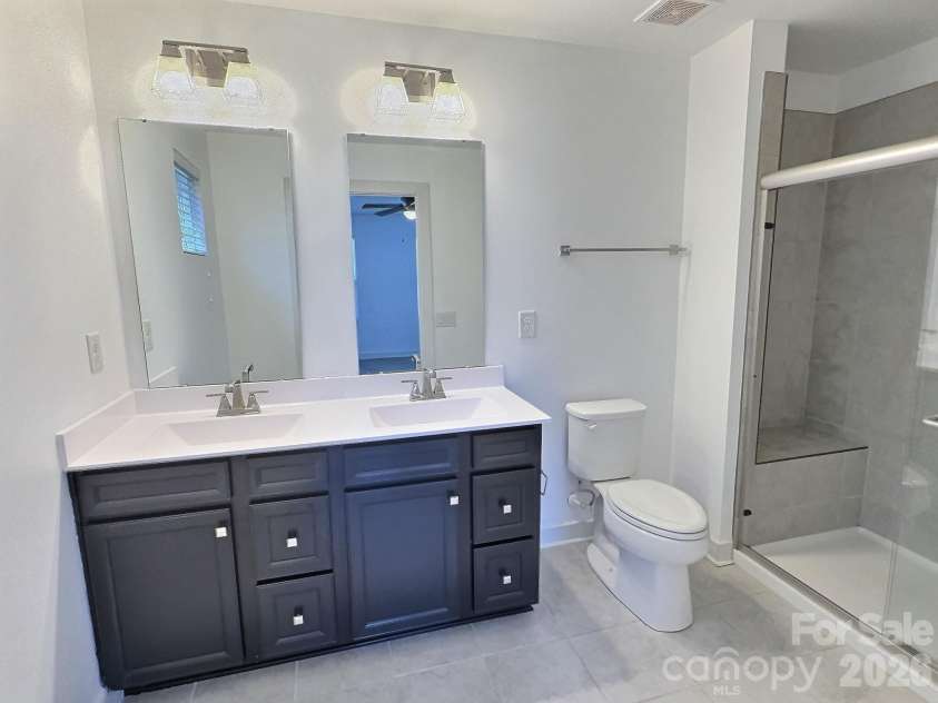 544 Grandiflora Avenue, Lancaster, SC 29720.  MLS# CAR4377518, YatesRealty ID 20996. Primary bath with double sinks and stall shower