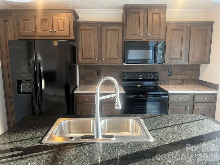 5748 Dalmatian Street, Iron Station, NC 28080.  MLS# CAR3927310, YatesRealty ID 2100. Kitchen