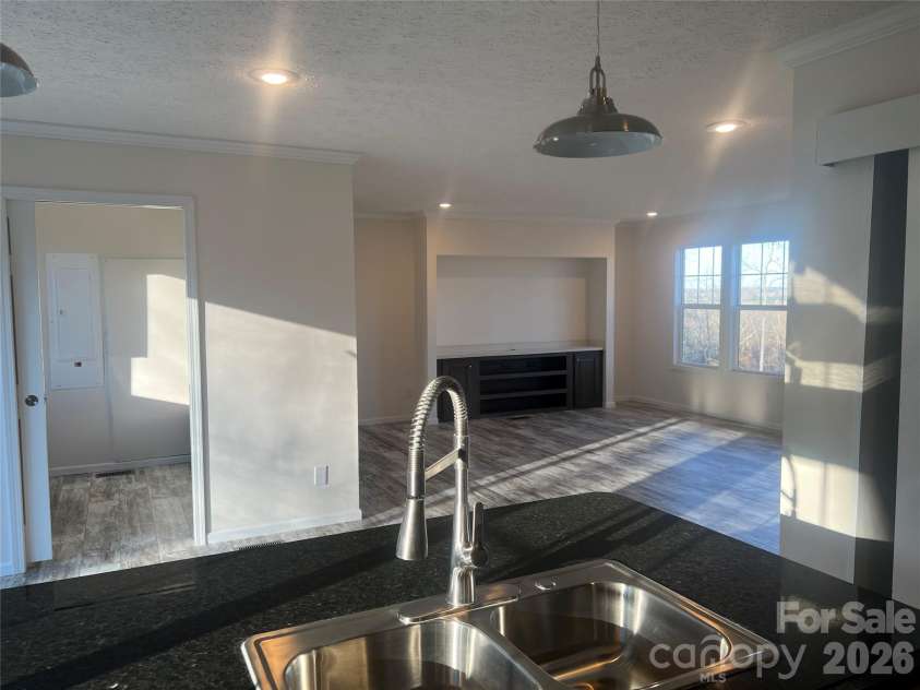 5748 Dalmatian Street, Iron Station, NC 28080.  MLS# CAR3927310, YatesRealty ID 2100. Kitchen to Great Room