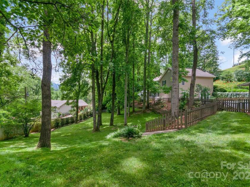 209 Blink Bonny Drive, Waynesville, NC 28786.  MLS# CAR4260662, YatesRealty ID 21001. Beautiful Backyard
