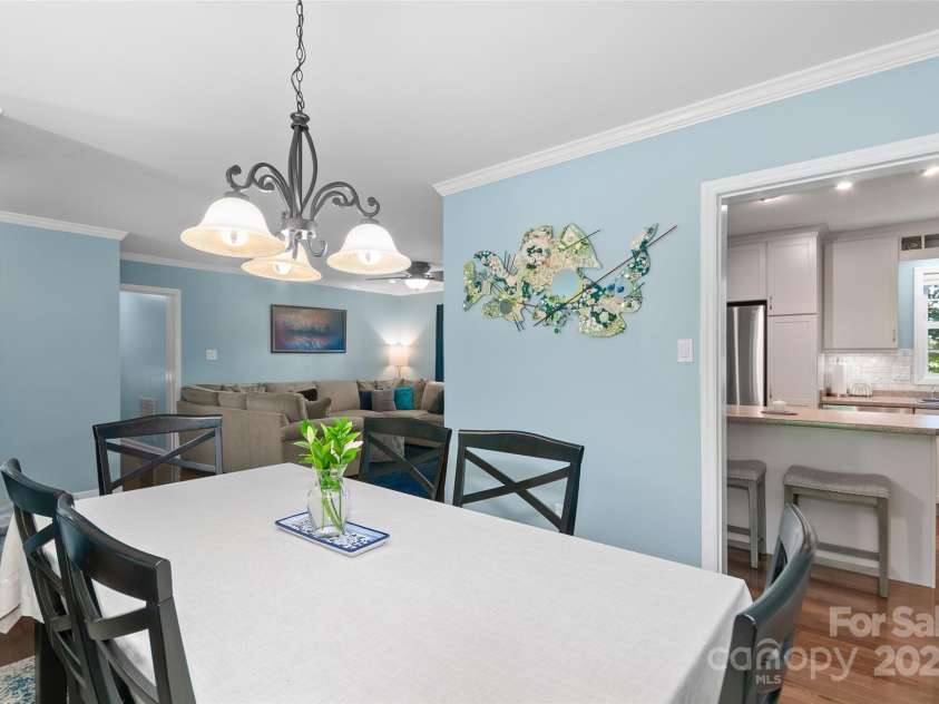 209 Blink Bonny Drive, Waynesville, NC 28786.  MLS# CAR4260662, YatesRealty ID 21001. Dining area into kitchen and living room
