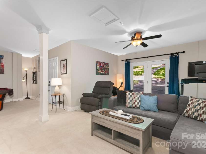 209 Blink Bonny Drive, Waynesville, NC 28786.  MLS# CAR4260662, YatesRealty ID 21001. Downstairs Great Room