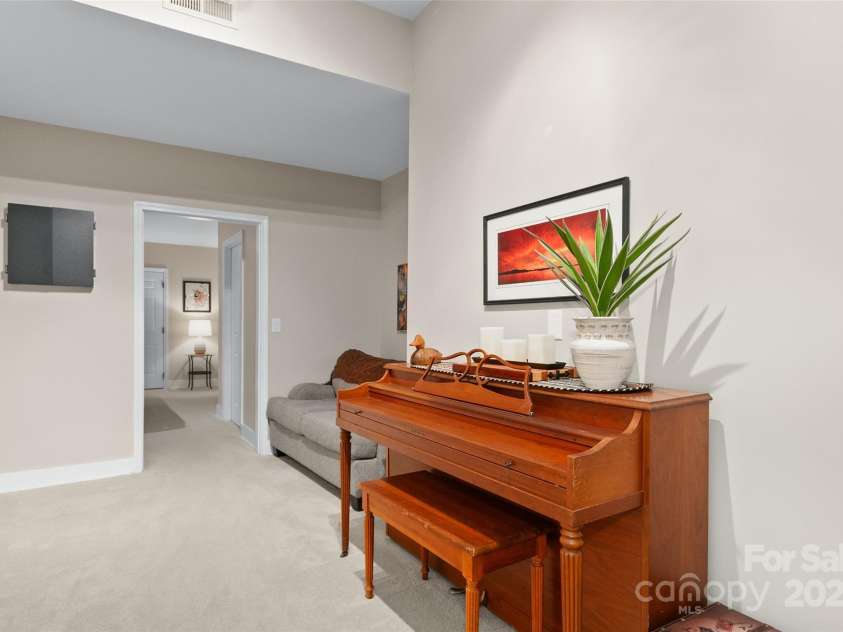 209 Blink Bonny Drive, Waynesville, NC 28786.  MLS# CAR4260662, YatesRealty ID 21001. Downstairs Sitting