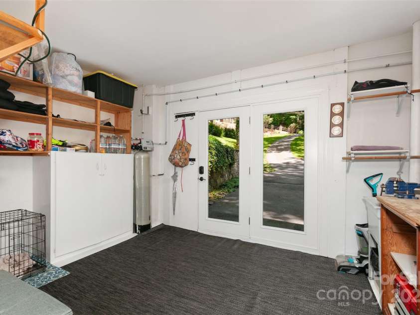 209 Blink Bonny Drive, Waynesville, NC 28786.  MLS# CAR4260662, YatesRealty ID 21001. Downstairs Utility/Workshop