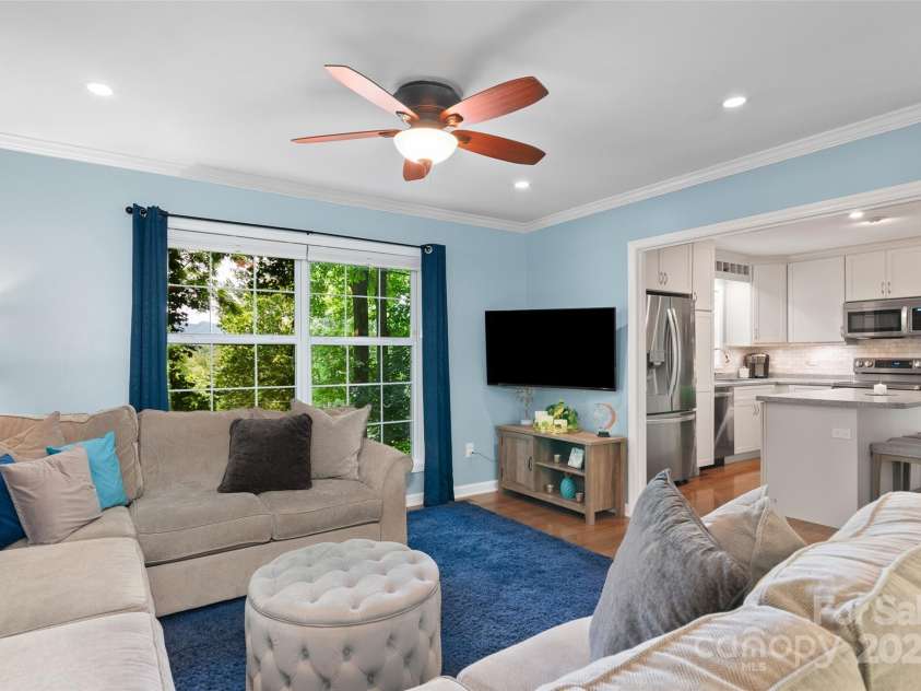 209 Blink Bonny Drive, Waynesville, NC 28786.  MLS# CAR4260662, YatesRealty ID 21001. Living area/great room into kitchen