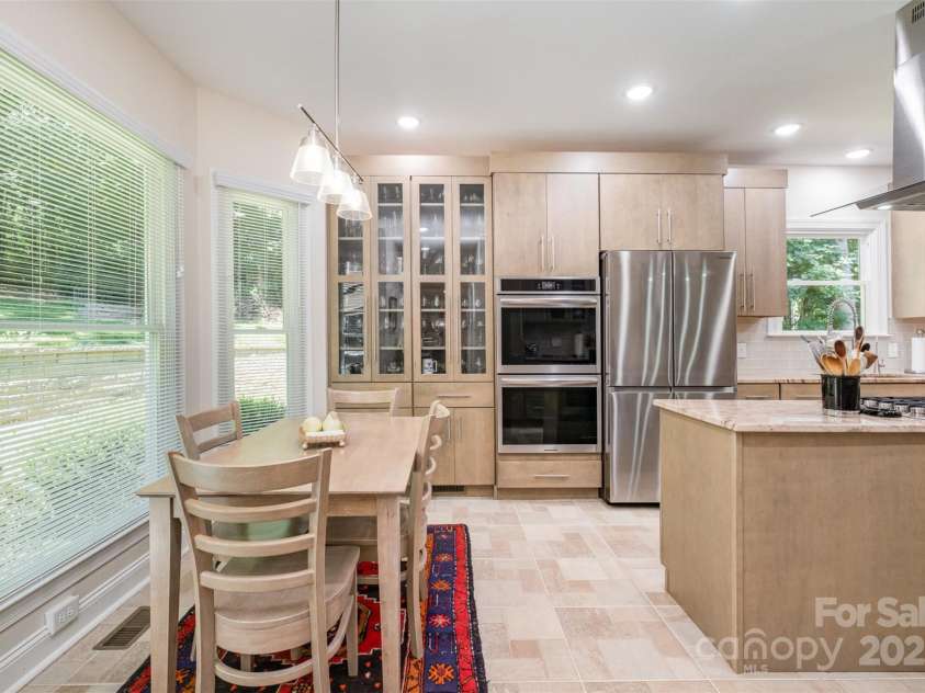 345 Beaten Path Road, Mooresville, NC 28117.  MLS# CAR4269577, YatesRealty ID 21006. Beautiful custom cabinetry with glass fronts to display your favorite dishes etc.