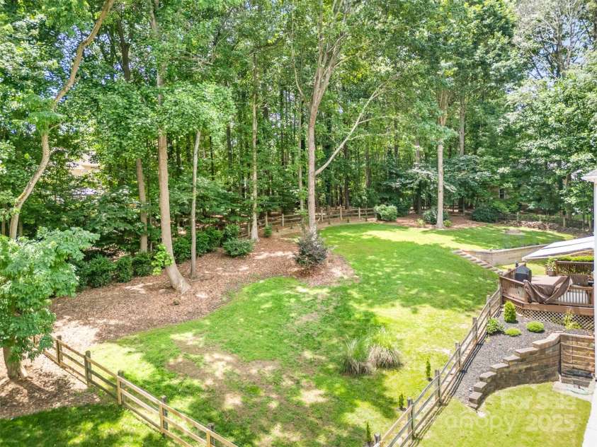 345 Beaten Path Road, Mooresville, NC 28117.  MLS# CAR4269577, YatesRealty ID 21006. Private, fenced back yard with beautiful mature trees.