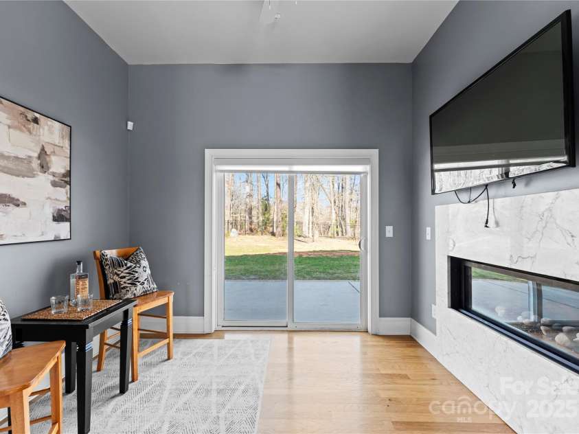 16455 Harbor View Road, Charlotte, NC 28278.  MLS# CAR4233006, YatesRealty ID 21013. Den with fireplace