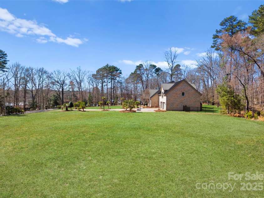 16455 Harbor View Road, Charlotte, NC 28278.  MLS# CAR4233006, YatesRealty ID 21013. Extensive grounds for a pool? Pickle ball? Tennis?