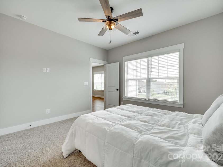 15312 Ravenall Drive, Huntersville, NC 28078.  MLS# CAR4247348, YatesRealty ID 21018. Guest bed with ensuite