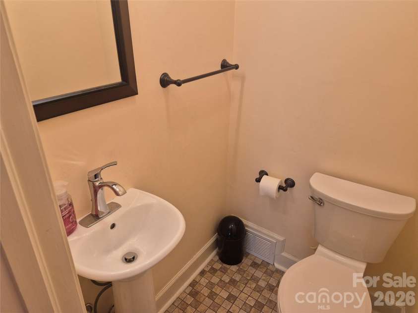 215 Biscoe Road, Troy, NC 27371.  MLS# CAR4346289, YatesRealty ID 2102. Half Bath - Downstairs