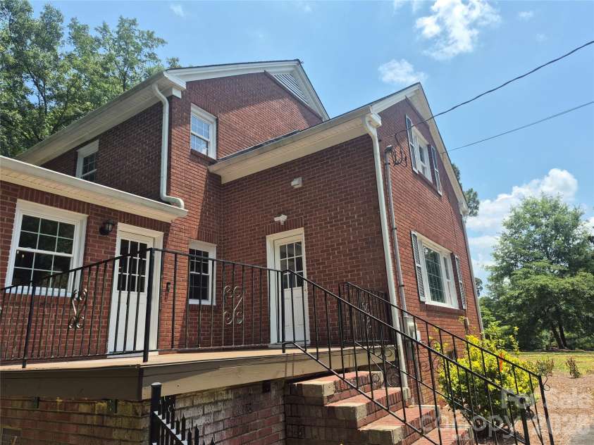 215 Biscoe Road, Troy, NC 27371.  MLS# CAR4346289, YatesRealty ID 2102. Side Deck