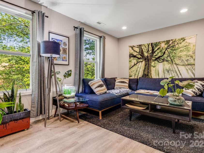 19 Shadowlawn Drive, Asheville, NC 28806.  MLS# CAR4258649, YatesRealty ID 21020. Cozy upstairs conversation area with natural light pouring in from every angle