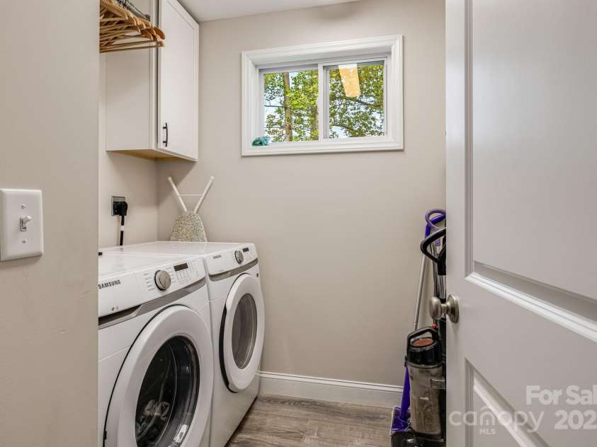 19 Shadowlawn Drive, Asheville, NC 28806.  MLS# CAR4258649, YatesRealty ID 21020. Laundry closet with washer/dryer and built-in shelving
