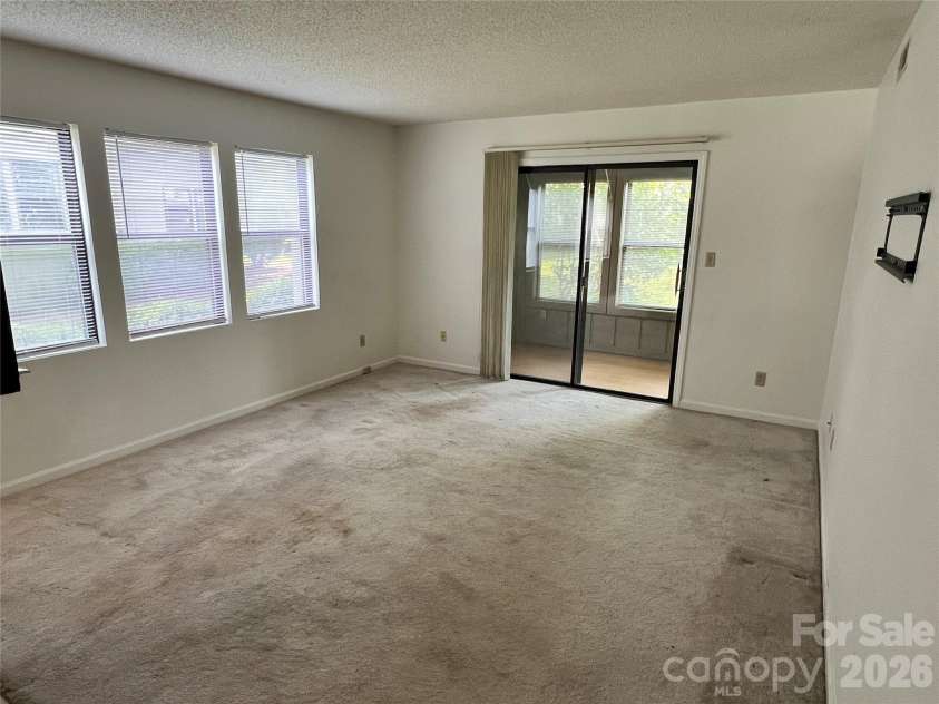2401 Abbey Circle, Asheville, NC 28805.  MLS# CAR4379167, YatesRealty ID 21020. End unit means way more windows and light!