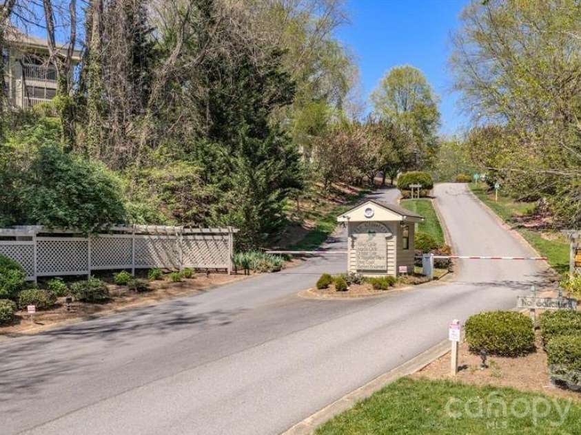 2401 Abbey Circle, Asheville, NC 28805.  MLS# CAR4379167, YatesRealty ID 21020. Gated entrance with mailboxes here.