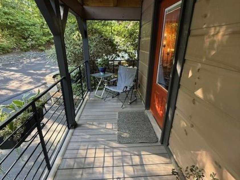 26 Cumberland Drive, Lake Toxaway, NC 28747.  MLS# CAR4262953, YatesRealty ID 21021. Inviting front porch area