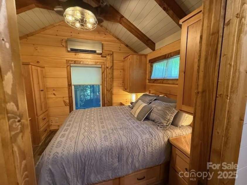 26 Cumberland Drive, Lake Toxaway, NC 28747.  MLS# CAR4262953, YatesRealty ID 21021. Primary bedroom with lots of built ins