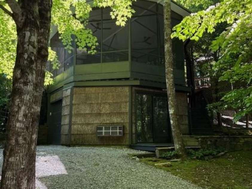 26 Cumberland Drive, Lake Toxaway, NC 28747.  MLS# CAR4262953, YatesRealty ID 21021. View from the back of the screened porch, bedroom and garage