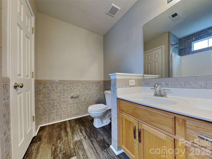 1032 Meadowbrook Lane, Concord, NC 28027.  MLS# CAR4380662, YatesRealty ID 21023. Primary bathroom