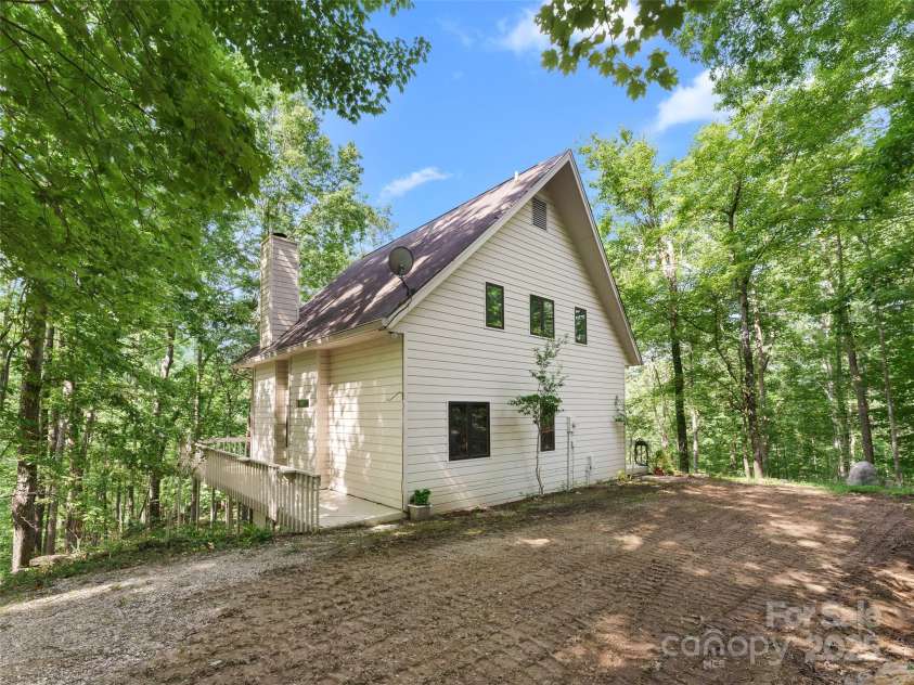 43 Hungryneck Hollow Lane, Saluda, NC 28773.  MLS# CAR4268230, YatesRealty ID 21027. Back view of house from Driveway