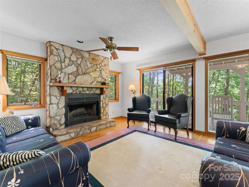 43 Hungryneck Hollow Lane, Saluda, NC 28773.  MLS# CAR4268230, YatesRealty ID 21027. Main level living area fireplace