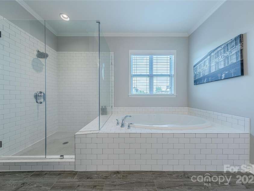 5256 Meadowcroft Way, Fort Mill, SC 29708.  MLS# CAR4270584, YatesRealty ID 21030. Glass Enclosed Shower & Garden Tub