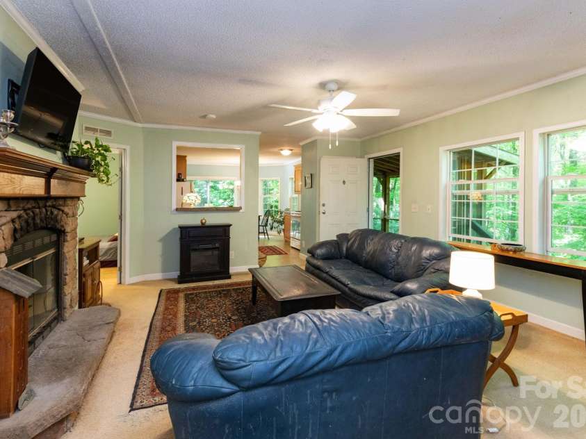 159 Marcellina Drive, Fairview, NC 28730.  MLS# CAR4377799, YatesRealty ID 21031. Spacious living room. 