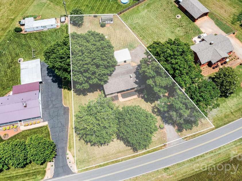 3372 Lee Lawing Road, Lincolnton, NC 28092.  MLS# CAR4268595, YatesRealty ID 21035. Nestled on over half an acre with a carport, storage sheds and a even a chicken coop