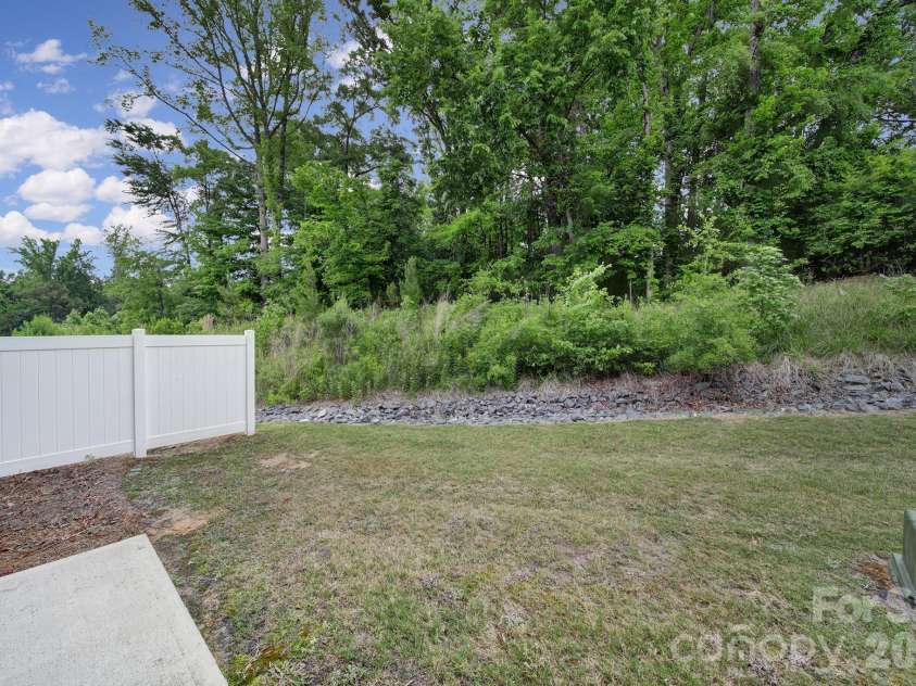 516 Madison Falls Court, Fort Mill, SC 29708.  MLS# CAR4380999, YatesRealty ID 21036. Back Exterior - Private Backyard
