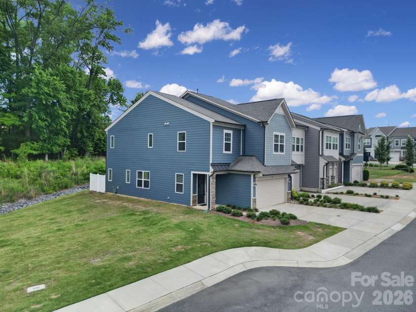 516 Madison Falls Court, Fort Mill, SC 29708.  MLS# CAR4380999, YatesRealty ID 21036. Front Exterior - End Unit, 2 Car Garage, Private Backyard, Next to Green Space