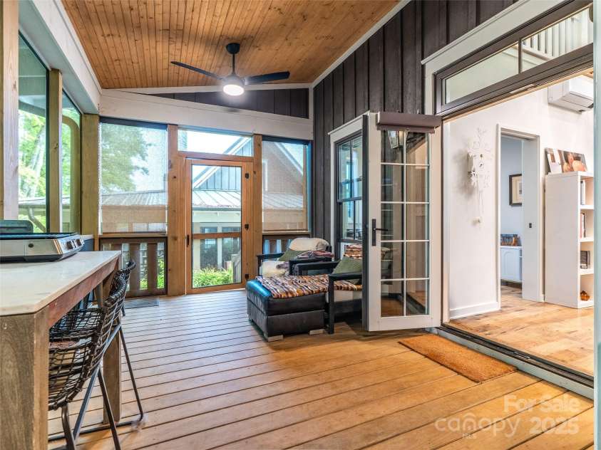15 Fay Jones Lane, Black Mountain, NC 28711.  MLS# CAR4259163, YatesRealty ID 21038. Screen porch opens to path that leads to private gate to dog park.