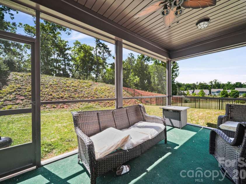 157 Old Harbor Drive, Mount Gilead, NC 27306.  MLS# CAR4375307, YatesRealty ID 21038. Screened back porch