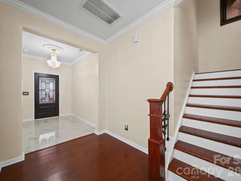 157 Old Harbor Drive, Mount Gilead, NC 27306.  MLS# CAR4375307, YatesRealty ID 21038. Staircase on main level
